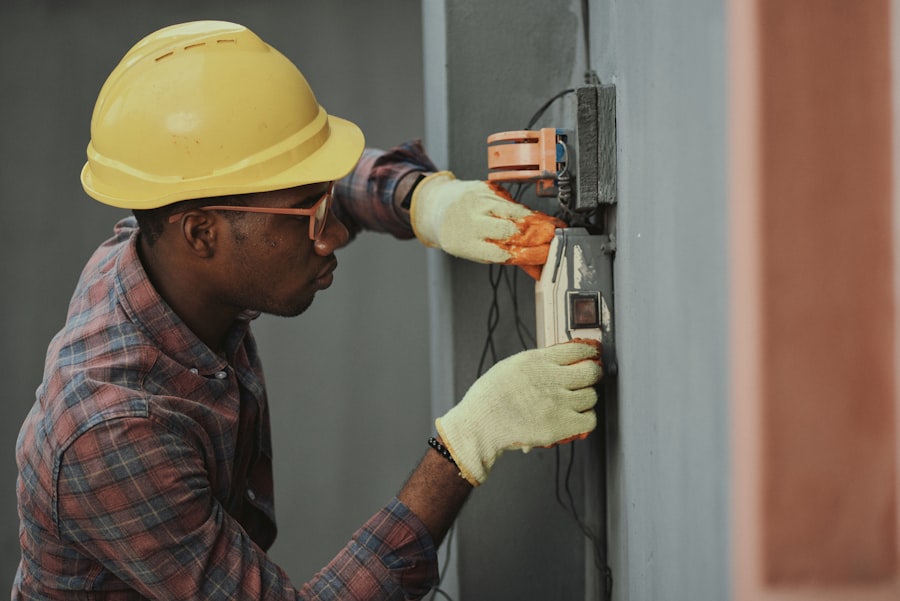 Electrician wiring a device during a rewire